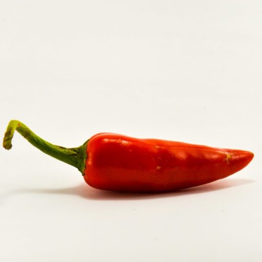 red chili on white surface